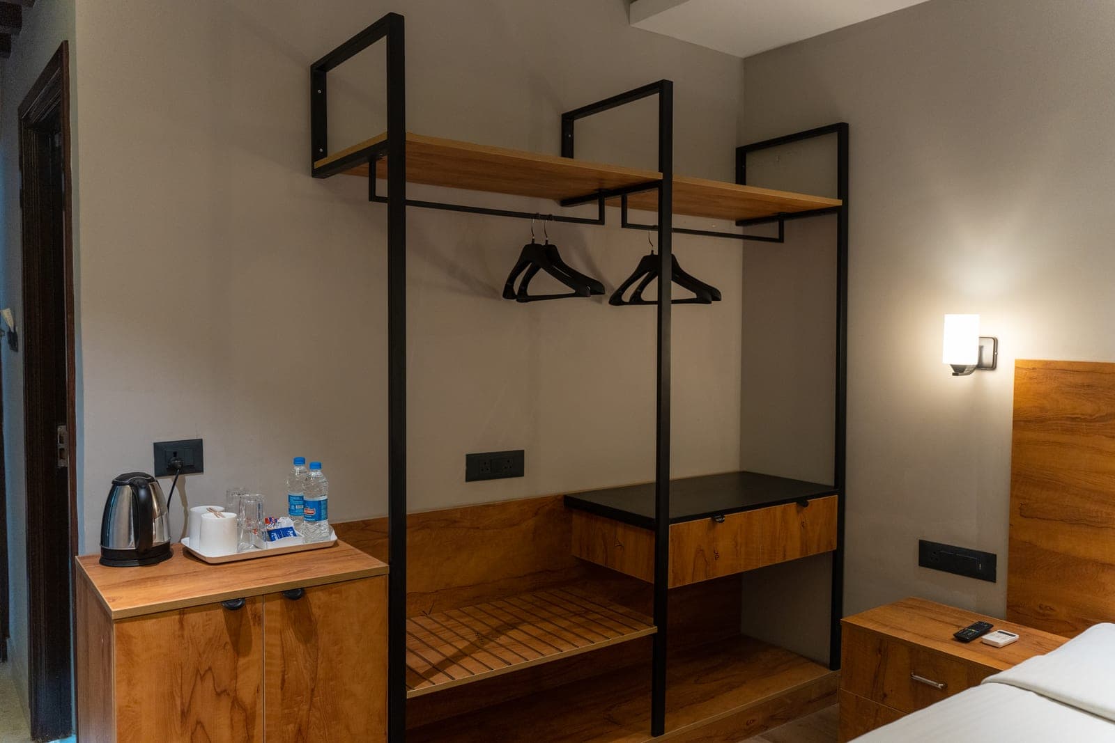 Open wardrobe and tea station in a Premium room