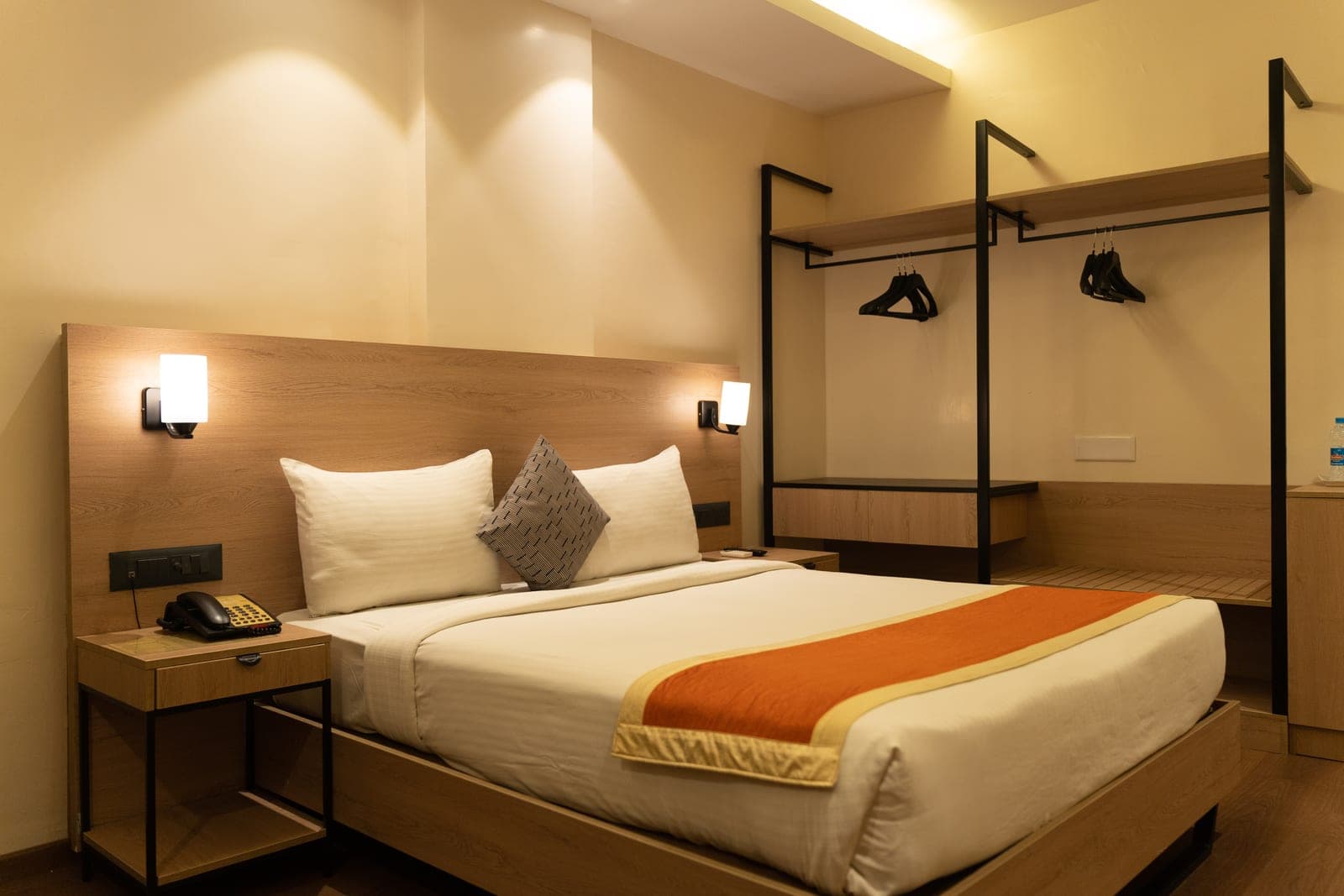 Executive room with open wardrobe at The Elite Royale
